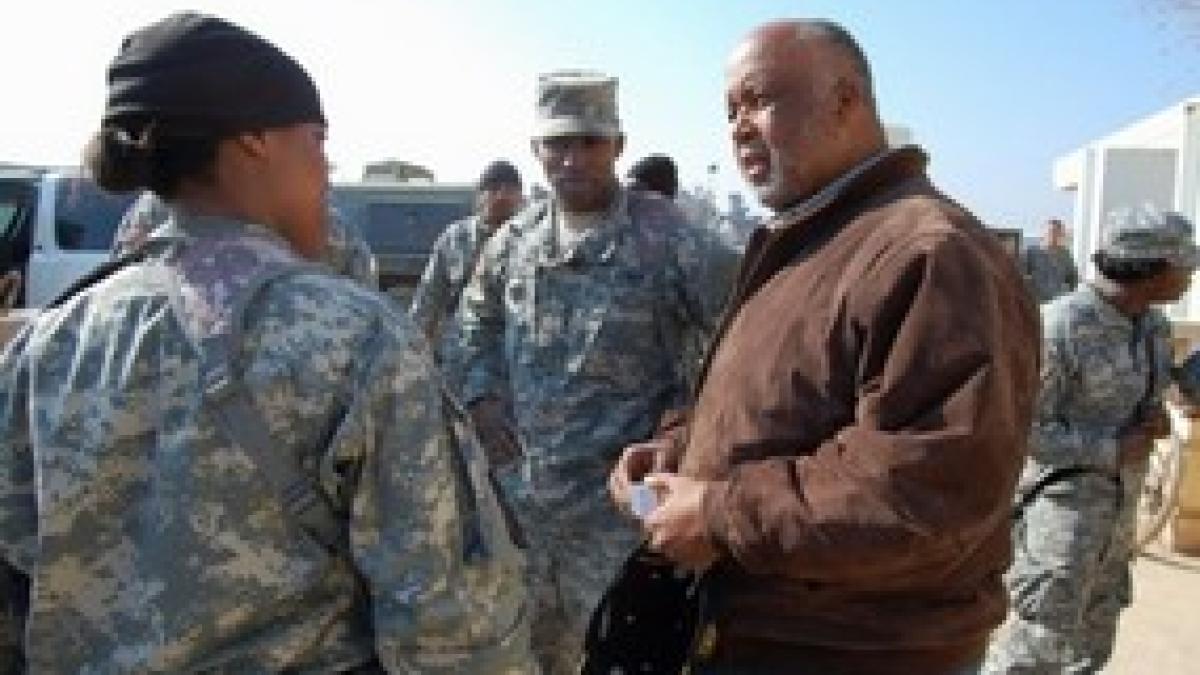 Congressman Bennie Thompson speaking with servicemember