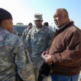 Congressman Bennie Thompson speaking with servicemember