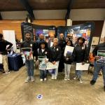 Congressman Thompson with students in front of NASA booth at 2024 College & Career Fair