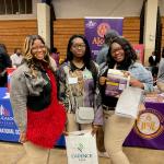 Students posing at Alcorn State University booth during 2024 College &  Career Fair