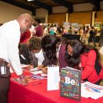 College and career fair attendee at table
