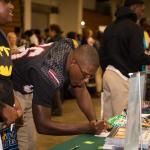 College and career fair attendee at table