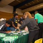 College and career fair attendee at table