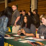College and career fair attendee at table