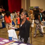College and career fair attendee at table