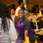 Staff at table for college and career fair