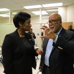 Congressman Bennie Thompson talking with woman