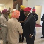 Congressman Bennie Thompson talking with men