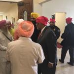 Congressman Bennie Thompson talking with men