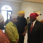 Congressman Bennie Thompson talking with men