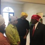 Congressman Bennie Thompson talking with men