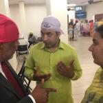 Congressman Bennie Thompson talking with man and woman