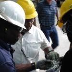 Congressman Bennie Thompson with people wearing hard hats