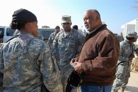 Congressman Bennie Thompson speaking with servicemember